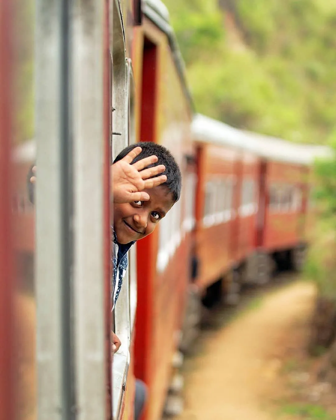 Sri Lankan child waves and smiles